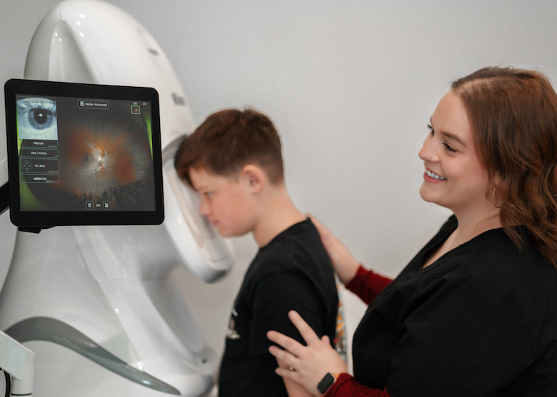 Pediatric patient receiving a comprehensive eye exam